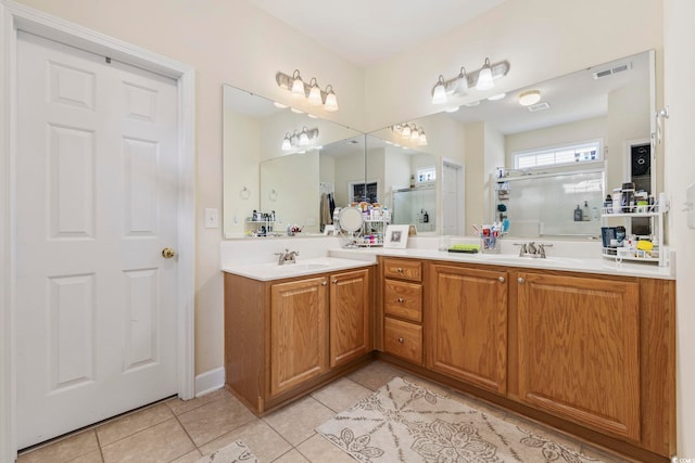 full bath featuring tile patterned floors, visible vents, and a sink