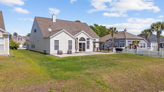 back of property with a patio area, fence, a yard, a pergola, and a chimney