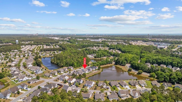 drone / aerial view featuring a water view and a residential view
