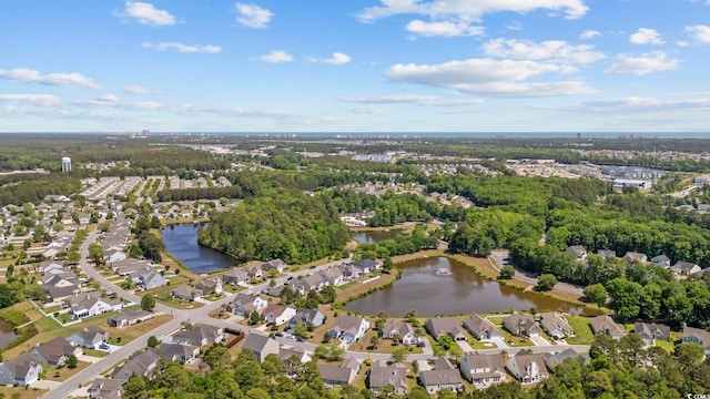 aerial view featuring a water view and a residential view
