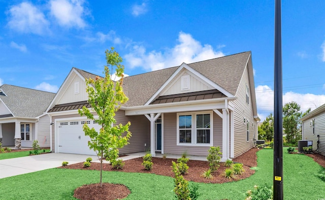 view of front of house featuring board and batten siding, central air condition unit, a standing seam roof, driveway, and a garage