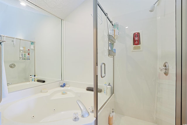bathroom with a stall shower and a whirlpool tub