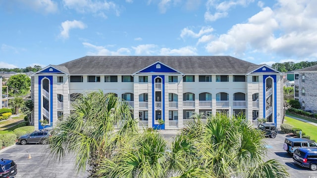 view of property with uncovered parking