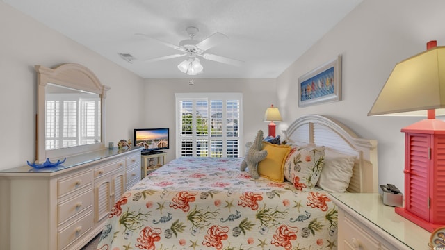 bedroom with a ceiling fan and visible vents