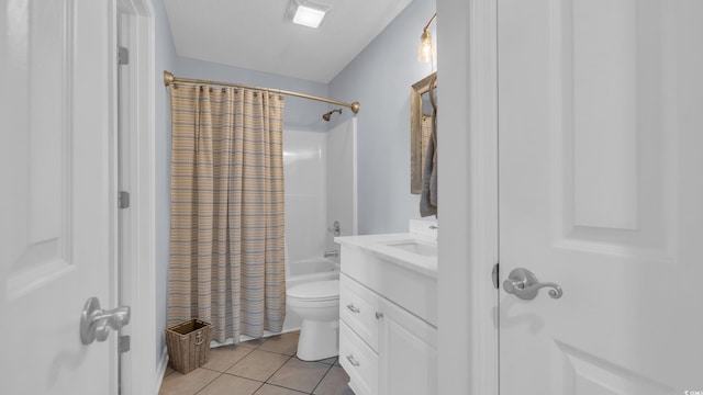 bathroom featuring vanity, tile patterned flooring, toilet, and shower / bath combination with curtain