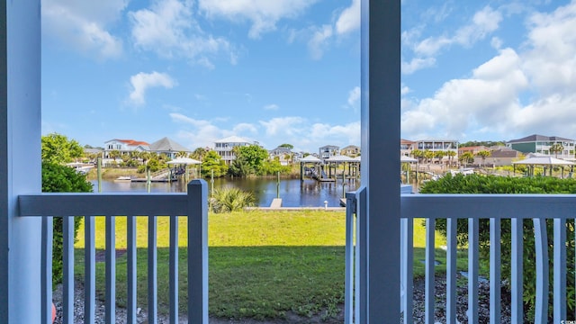 view of water feature featuring a boat dock and a residential view