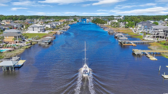 bird's eye view featuring a water view and a residential view