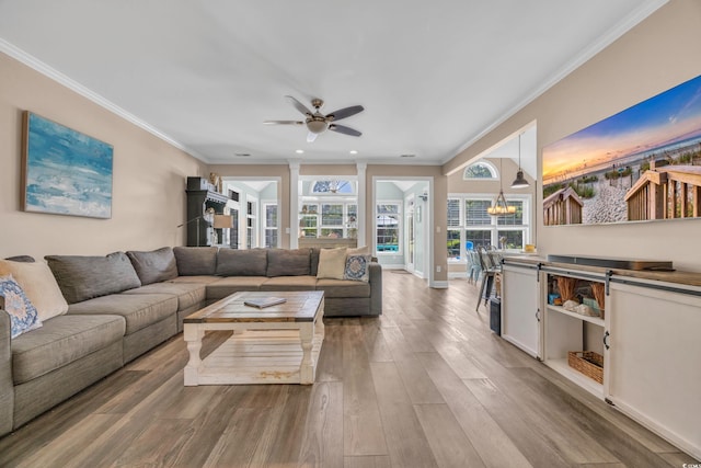 1203 Crooked Oak Dr, Pawleys Island, SC 29585 - living area featuring recessed lighting, baseboards, ceiling fan with notable chandelier, crown molding, and wood finished floors