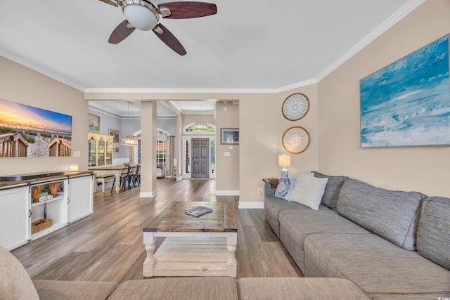 1203 Crooked Oak Dr, Pawleys Island, SC 29585 - living area with crown molding, wood finished floors, baseboards, and ceiling fan