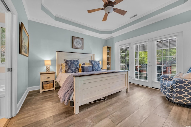 1203 Crooked Oak Dr, Pawleys Island, SC 29585 - bedroom with crown molding, access to outside, visible vents, and multiple windows