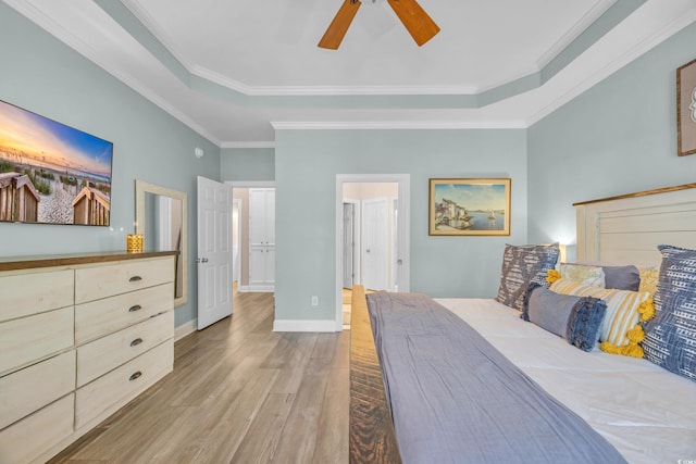 1203 Crooked Oak Dr, Pawleys Island, SC 29585 - bedroom with wood finished floors, a ceiling fan, a tray ceiling, crown molding, and baseboards