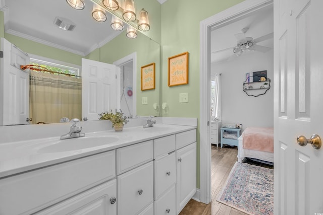 1203 Crooked Oak Dr, Pawleys Island, SC 29585 - full bath featuring double vanity, wood finished floors, a sink, visible vents, and ornamental molding