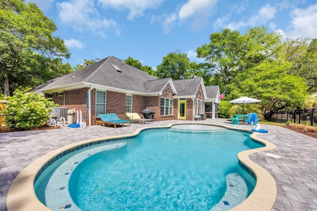 1203 Crooked Oak Dr, Pawleys Island, SC 29585 - view of swimming pool with fence, a patio, a fenced in pool, and area for grilling