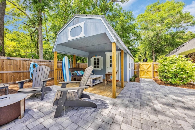 1203 Crooked Oak Dr, Pawleys Island, SC 29585 - view of patio / terrace with a fenced backyard, a wooden deck, and a gate