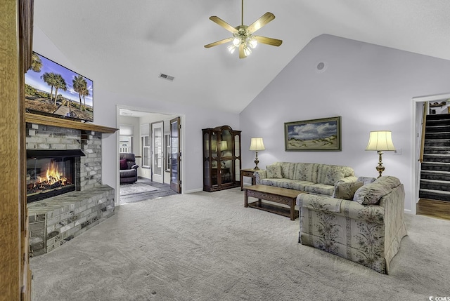 552 Enoree Ct, Myrtle Beach, SC 29588 - living room with a ceiling fan, high vaulted ceiling, a fireplace, carpet floors, and visible vents