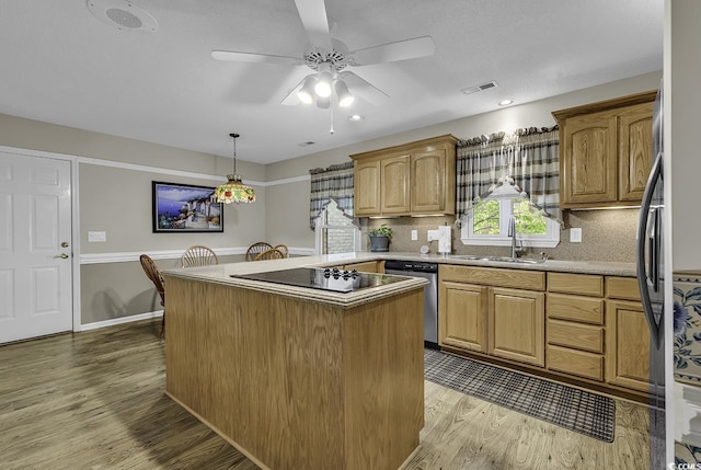 552 Enoree Ct, Myrtle Beach, SC 29588 - kitchen featuring a ceiling fan, dishwasher, light wood finished floors, a sink, and black electric stovetop