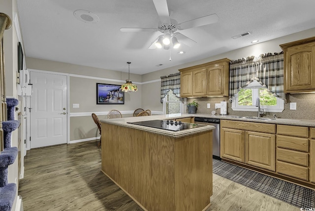 552 Enoree Ct, Myrtle Beach, SC 29588 - kitchen featuring a center island, wood finished floors, a sink, stainless steel dishwasher, and visible vents