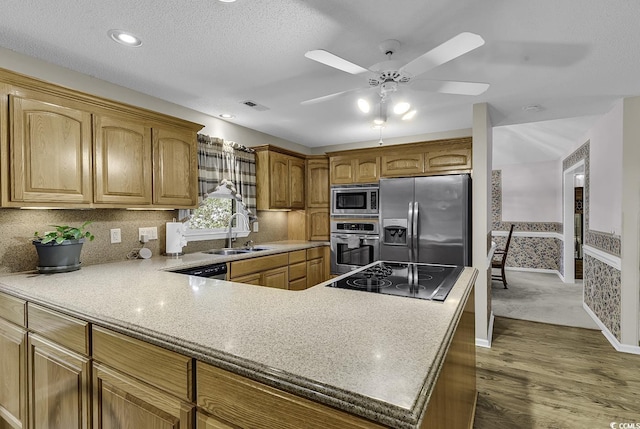 552 Enoree Ct, Myrtle Beach, SC 29588 - kitchen with a sink, wood finished floors, visible vents, ceiling fan, and appliances with stainless steel finishes