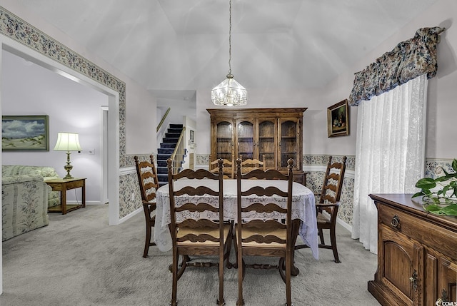 552 Enoree Ct, Myrtle Beach, SC 29588 - dining space featuring lofted ceiling, stairs, a notable chandelier, and light colored carpet