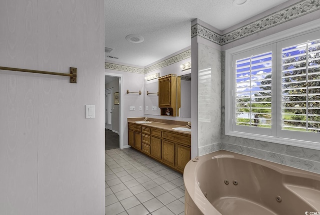 552 Enoree Ct, Myrtle Beach, SC 29588 - full bathroom featuring a sink, a tub with jets, a textured ceiling, tile patterned floors, and double vanity