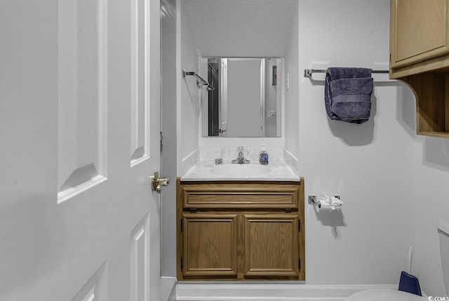 552 Enoree Ct, Myrtle Beach, SC 29588 - bathroom with vanity, toilet, and a textured ceiling