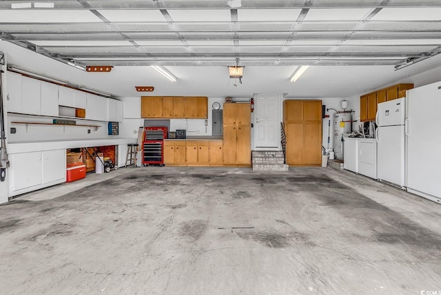 552 Enoree Ct, Myrtle Beach, SC 29588 - garage featuring freestanding refrigerator, water heater, washer and clothes dryer, and electric panel