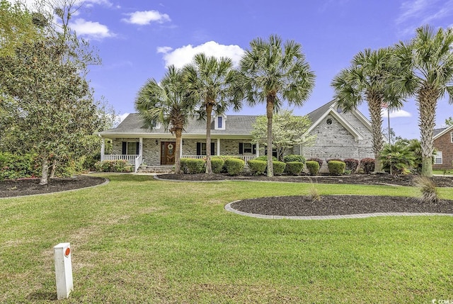 552 Enoree Ct, Myrtle Beach, SC 29588 - ranch-style home featuring a front lawn, covered porch, and brick siding
