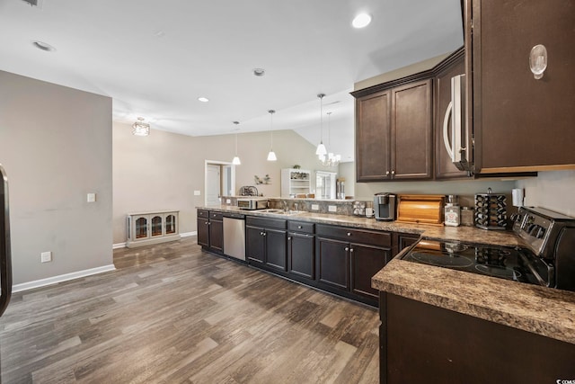 103 Teal Ct, Myrtle Beach, SC 29588 - kitchen featuring appliances with stainless steel finishes, dark brown cabinets, lofted ceiling, a peninsula, and dark wood-style floors
