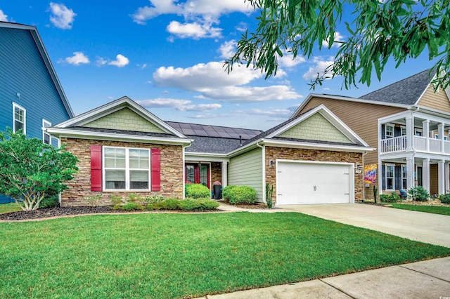 1286 Culbertson Ave, Myrtle Beach, SC 29577 - view of front facade with stone siding, a front lawn, solar panels, driveway, and an attached garage