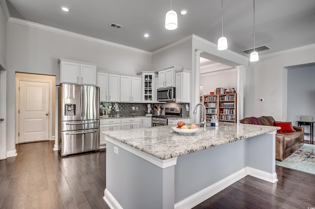 1286 Culbertson Ave, Myrtle Beach, SC 29577 - kitchen featuring stainless steel appliances, ornate columns, crown molding, dark wood-style floors, and light stone countertops