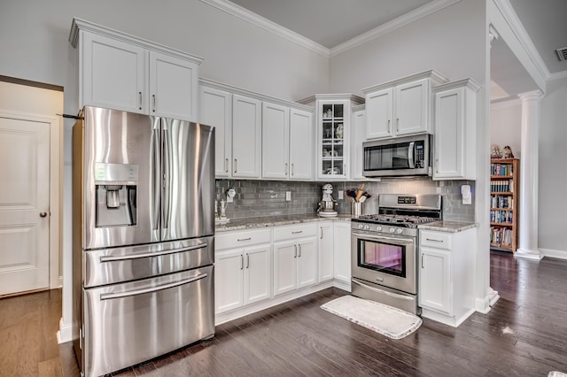 1286 Culbertson Ave, Myrtle Beach, SC 29577 - kitchen with appliances with stainless steel finishes, dark wood-type flooring, white cabinets, decorative columns, and crown molding
