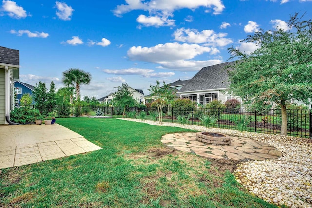 1286 Culbertson Ave, Myrtle Beach, SC 29577 - fenced backyard featuring a fire pit and a patio area