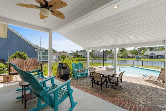 view of patio / terrace featuring a residential view, a fenced in pool, and a fenced backyard