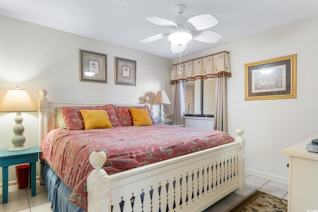 bedroom featuring tile patterned floors, baseboards, and ceiling fan