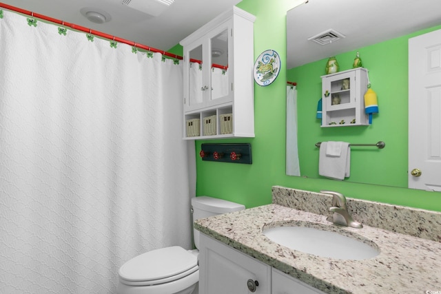 full bath featuring toilet and vanity