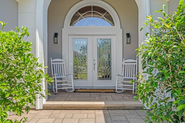 doorway to property with french doors and stucco siding