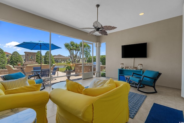 living room featuring a ceiling fan and recessed lighting