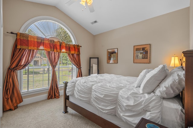 carpeted bedroom with lofted ceiling and a ceiling fan
