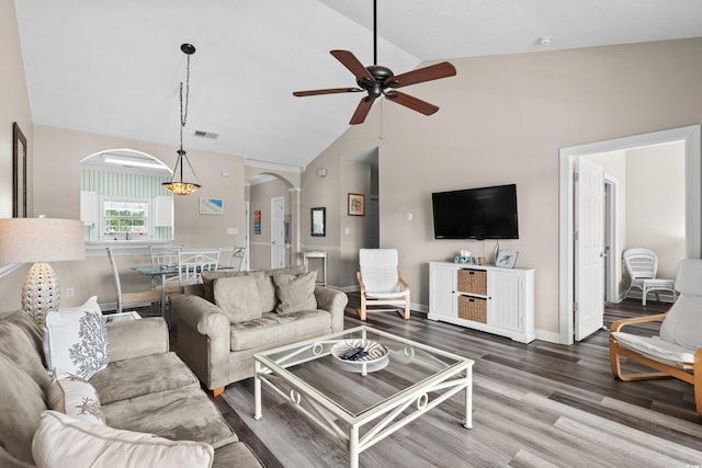 5751 Oyster Catcher Dr Unit 334, North Myrtle Beach, SC 29582 - living area with arched walkways, ceiling fan, wood finished floors, and high vaulted ceiling