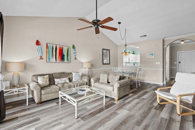 5751 Oyster Catcher Dr Unit 334, North Myrtle Beach, SC 29582 - living area featuring arched walkways, a ceiling fan, wood finished floors, and high vaulted ceiling