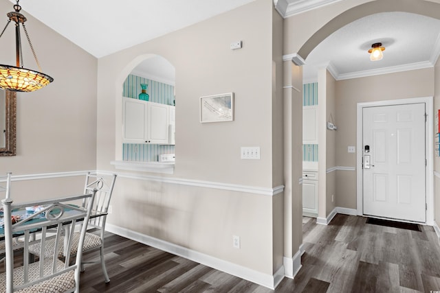 5751 Oyster Catcher Dr Unit 334, North Myrtle Beach, SC 29582 - foyer featuring arched walkways, dark wood finished floors, and crown molding