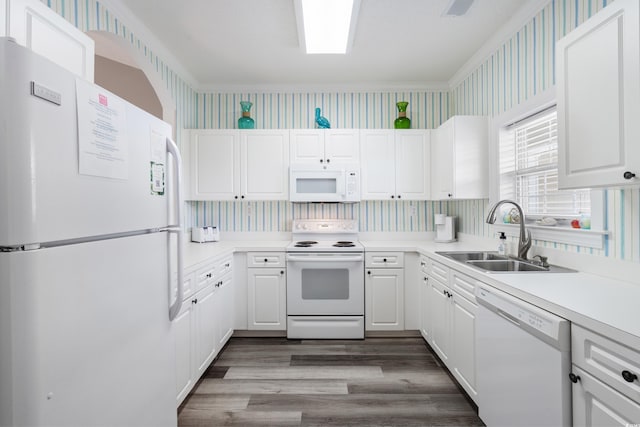5751 Oyster Catcher Dr Unit 334, North Myrtle Beach, SC 29582 - kitchen featuring white appliances, wallpapered walls, dark wood-style floors, white cabinetry, and light countertops