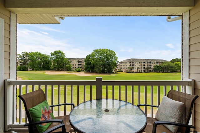 5751 Oyster Catcher Dr Unit 334, North Myrtle Beach, SC 29582 - balcony featuring outdoor dining area and golf course view