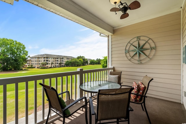 5751 Oyster Catcher Dr Unit 334, North Myrtle Beach, SC 29582 - balcony with a ceiling fan, outdoor dining space, and golf course view