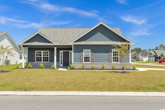 383 Hayloft Cir, Conway, SC 29526 - craftsman house with a porch, brick siding, a front yard, and roof with shingles