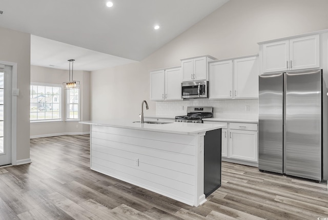 383 Hayloft Cir, Conway, SC 29526 - kitchen featuring stainless steel appliances, a sink, backsplash, light countertops, and white cabinets