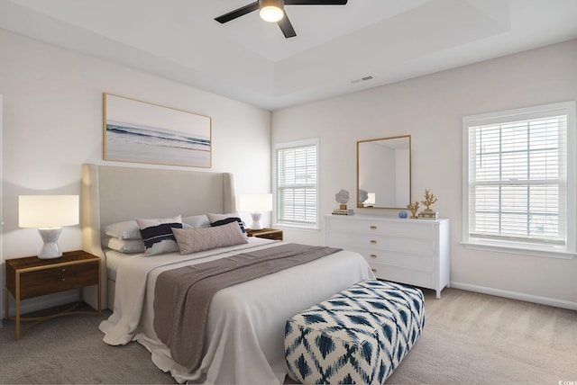 383 Hayloft Cir, Conway, SC 29526 - bedroom featuring light colored carpet, a tray ceiling, ceiling fan, and baseboards