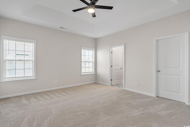 383 Hayloft Cir, Conway, SC 29526 - unfurnished bedroom featuring a tray ceiling, carpet flooring, baseboards, and a ceiling fan