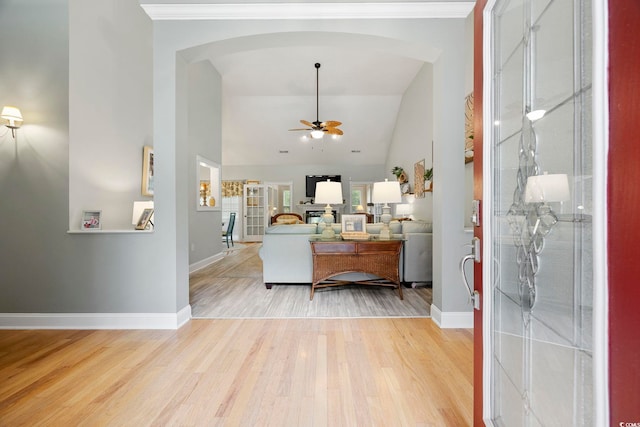 180 Waterhall Dr, Murrells Inlet, SC 29576 - living area featuring arched walkways, ceiling fan, light wood-style flooring, baseboards, and high vaulted ceiling