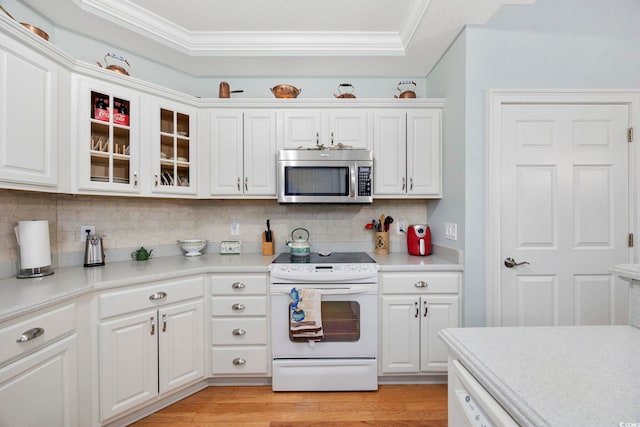 180 Waterhall Dr, Murrells Inlet, SC 29576 - kitchen featuring stainless steel microwave, white range with electric stovetop, ornamental molding, backsplash, and light countertops